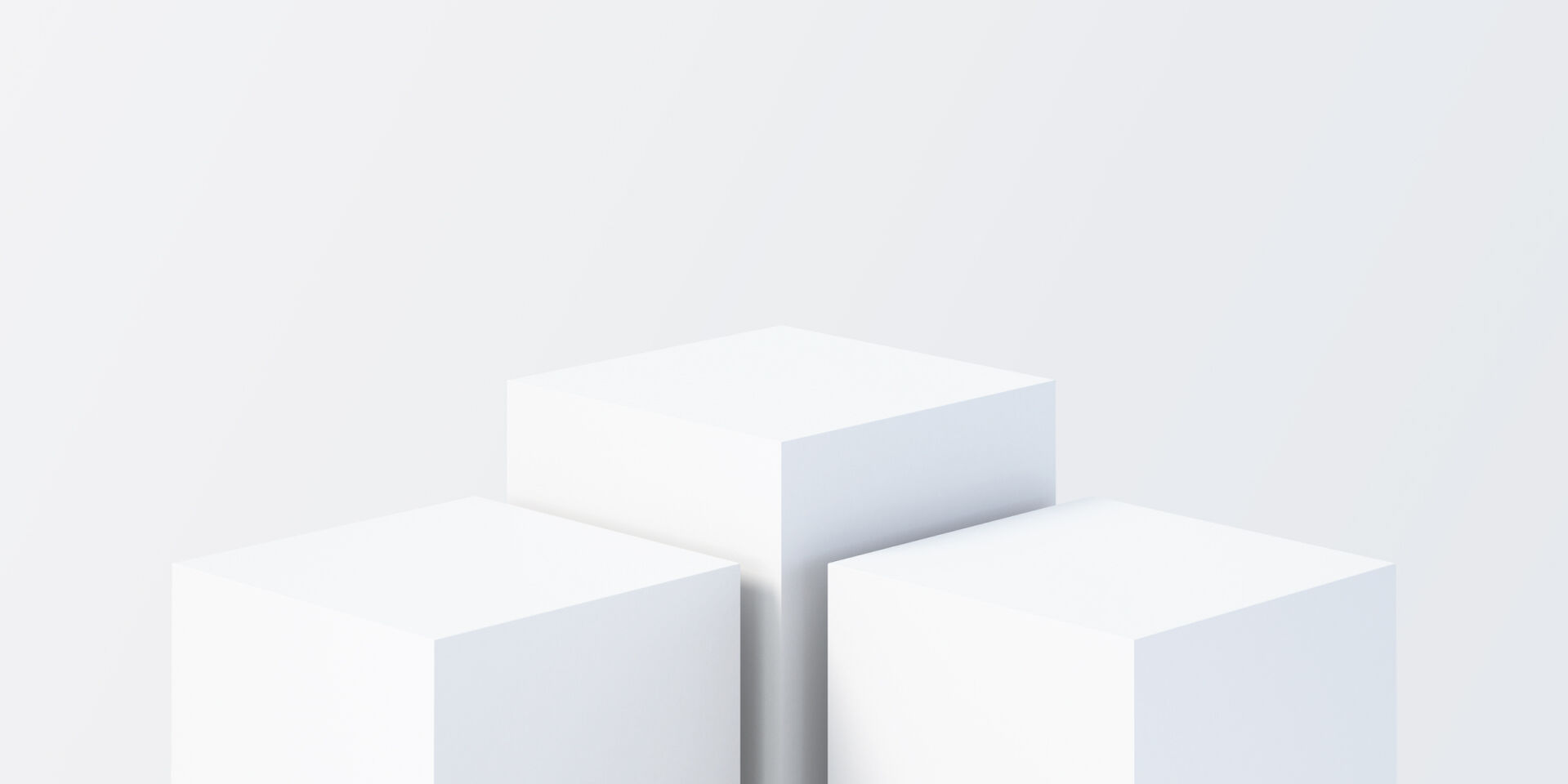 Eine abstrakte Abbildung von drei 3D-Würfeln auf einem weißen Hintergrund